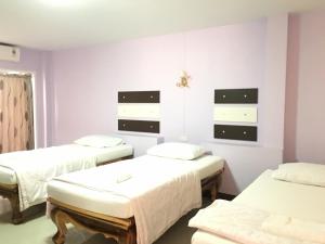Postel nebo postele na pokoji v ubytování The Star Villa Resort