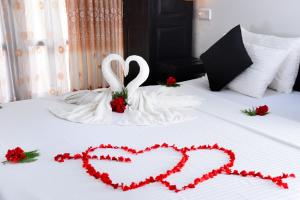 Ένα ή περισσότερα κρεβάτια σε δωμάτιο στο L&D Lodge