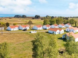 an aerial view of a row of houses in a field at Læsø Seaside Holiday Homes in Læsø