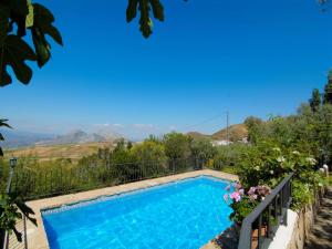 a swimming pool with a view of the mountains at Cottage in Antequera with Pool near El Torcal in La Joya +19 photos