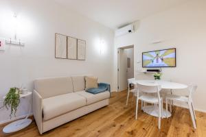 Un televizor și/sau centru de divertisment la Porta Venezia bilocale moderno