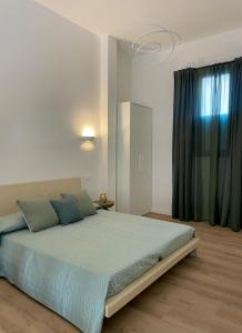 Postel nebo postele na pokoji v ubytování Casa vacanze La Casa di Leo