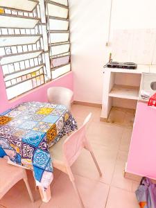 a room with a table and chairs and a desk at Pedro Teixeira House in Belém