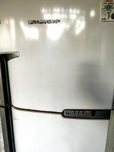 a close up of a white refrigerator with its door open at Pedro Teixeira House in Belém +4 photos