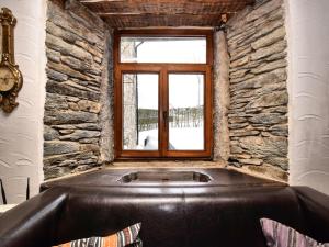 a bath tub in a room with a window at Spacious Stay, Tenneville in Tenneville