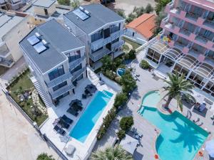 an aerial view of a resort with a swimming pool at Petra Suites Tolo in Tolo