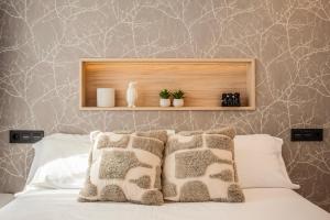 Giường trong phòng chung tại Cid III - Apartamentos Burgos Deluxe