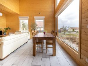 a dining room with a table and a couch at Wintersbourg Spa Retreat in Wintersbourg +32 photos