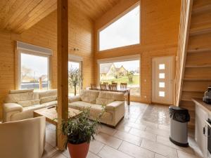 a living room with couches and windows at Wintersbourg Spa Retreat in Wintersbourg