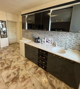 Kuchyň nebo kuchyňský kout v ubytování City Center Apartments + 4 fotografie