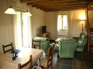 a living room with a table and chairs at Nature Escape in Loubressac in Loubressac +32 photos