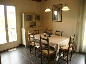 a dining room with a table and chairs at Nature Escape in Loubressac in Loubressac