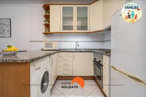 a kitchen with a sink and a dishwasher at #230 Only Families - Flat A Flor by Home Holidays in Vale de Pedras