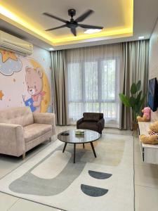 a living room with a couch and a table at Teddyslodge Homestay in Kajang