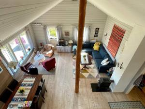 an overhead view of a living room with a blue couch at 4 star holiday home in Espevær in Espevær