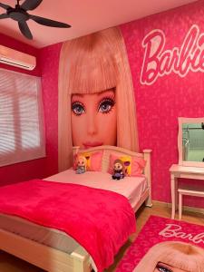 a bedroom with a bed with a barbie wall at Teddyslodge Homestay in Kajang +34 photos