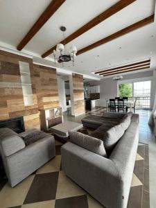 a living room with two couches and a fireplace at Villa Smokovac in Risan +86 photos