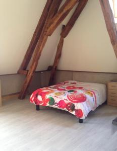 a bedroom with a bed in a attic at Cœur de Loire in Nevers
