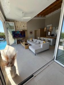 a living room with a couch and a table at Villa Dottori in Koinyra +16 photos
