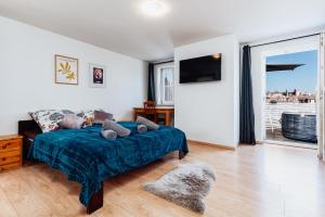 Ένα ή περισσότερα κρεβάτια σε δωμάτιο στο Elephant Luxury Penthouse