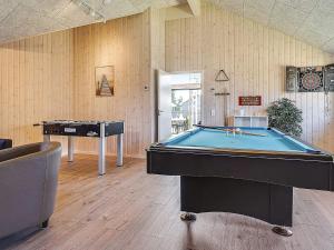 a billiard room with a pool table and a table at 16 person holiday home in Hasselberg in Kappeln +7 photos