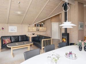 a living room with a couch and a table at 7 person holiday home in Ulfborg-By Traum in Sønder Nissum