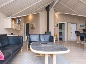 a living room with a couch and a table at 7 person holiday home in Ulfborg-By Traum in Sønder Nissum