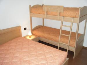 Giường trong phòng chung tại Residenza al Ponte appartamenti 1 e 2