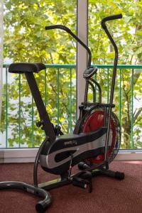 a exercise bike sitting in front of a window at Unperfekthotel CoWorkingHotel in Essen