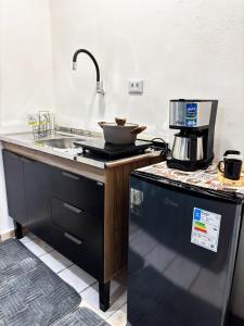 Dapur atau dapur kecil di Vila Alves Loft +12 gambar