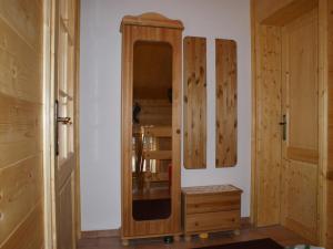 a room with a wooden cabinet and a door at Chalet in Sankt Gallenkirch near Ski Bus in Sankt Gallenkirch
