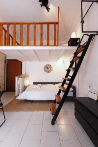 a bedroom with a bed and a spiral staircase at PrimoPiano - Pacini in Milan