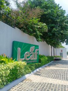 a sign on the side of a building at LEAF RESIDENCES MUNTINLUPA - M&G Staycation in Manila