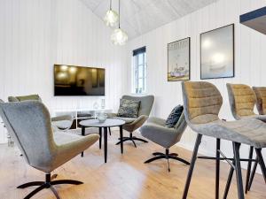 a waiting room with chairs and a table at 5 star holiday home in Sydals in Sarup