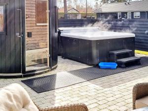 a bath tub with smoke coming out of it at 14 person holiday home in Væggerløse in Marielyst
