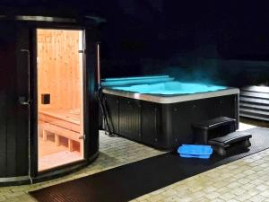 a hot tub with smoke coming out of it at 14 person holiday home in Væggerløse in Marielyst