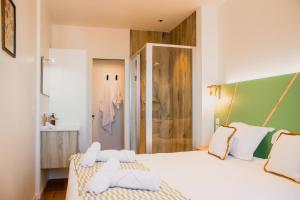 a bedroom with two beds with towels on them at Sainte-Cécile in Marseille