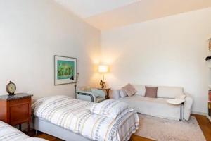 a living room with two beds and a couch at Cessinas in Groningen