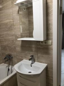 Koupelna v ubytování Квартира біля парку Софіївка + 12 fotografií