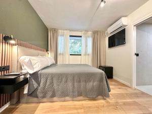 Ένα ή περισσότερα κρεβάτια σε δωμάτιο στο Hostal Rambla Alicante