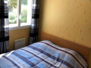 a bedroom with a bed and a window with curtains at Panoramic Poolside Villa in La Croix-Blanche +32 photos