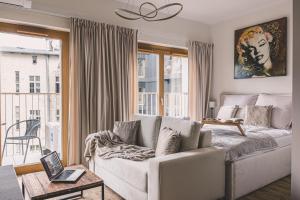 Posezení v ubytování 2HomeRent Apartamenty Nowy Port