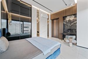 A bed or beds in a room at Chandelier Sky Mansion Még 63 kép