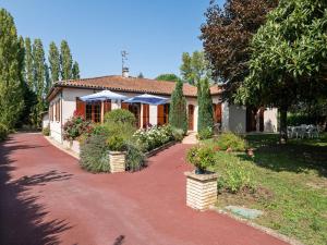 a house with a red brick walkway in front of it at Dordogne Villa River Bliss in Pineuilh