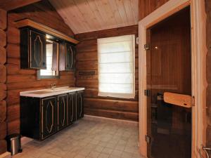 a bathroom with a sink and a window at 12 person holiday home in Fåvang-By Traum in Favang +3 photos