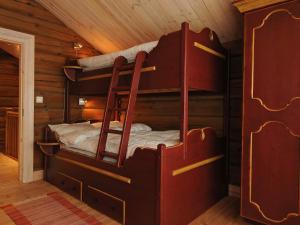 a bedroom with two bunk beds in a cabin at 12 person holiday home in Fåvang-By Traum in Favang