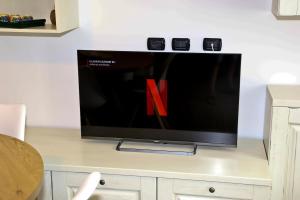 a flat screen tv sitting on top of a table at Da Santa - Center, Fiera Rho, Malpensa, Milan, Laghi in Legnano +4 photos