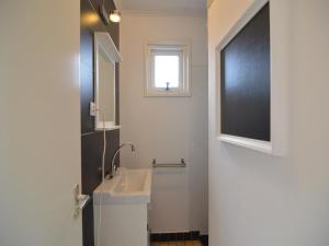 a bathroom with a sink and a window at Holiday Home Koewacht near Seaside in Nieuwemolen +30 photos