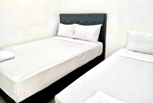 Postel nebo postele na pokoji v ubytování Pavo Resort