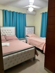 Ένα ή περισσότερα κρεβάτια σε δωμάτιο στο Residencial F&M Pedernales